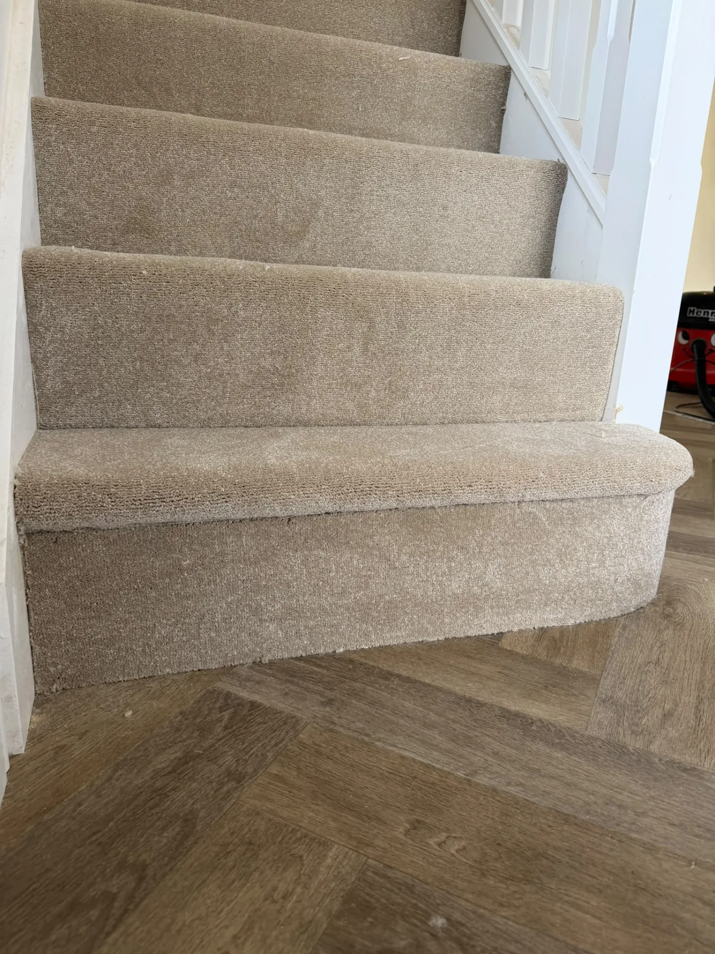 Carpet tailored neatly around a bullnose bottom step, Signature Carpets and Flooring, Greater Manchester