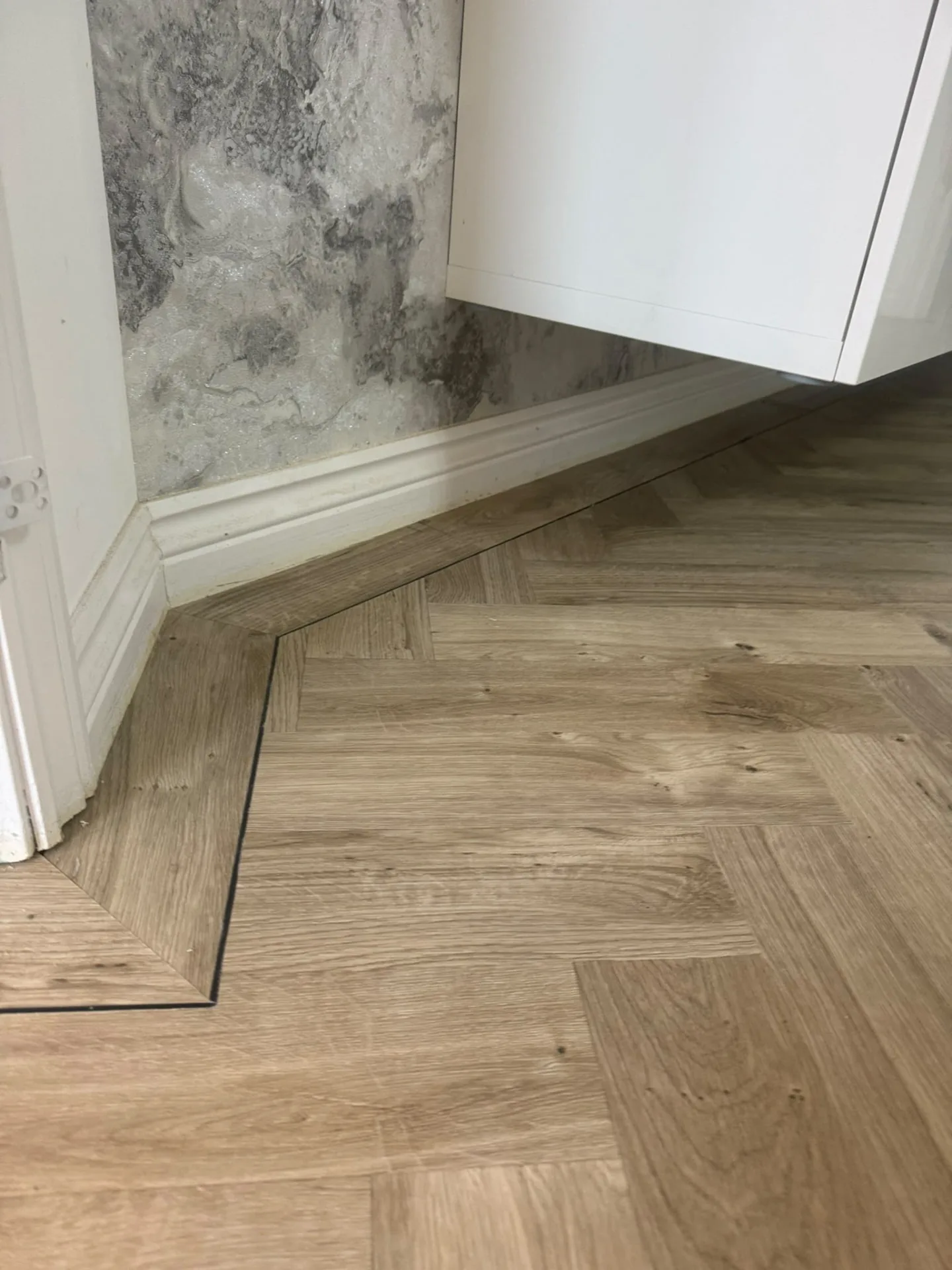 Herringbone LVT with a border fitted along the skirting, Signature Carpets and Flooring, Greater Manchester