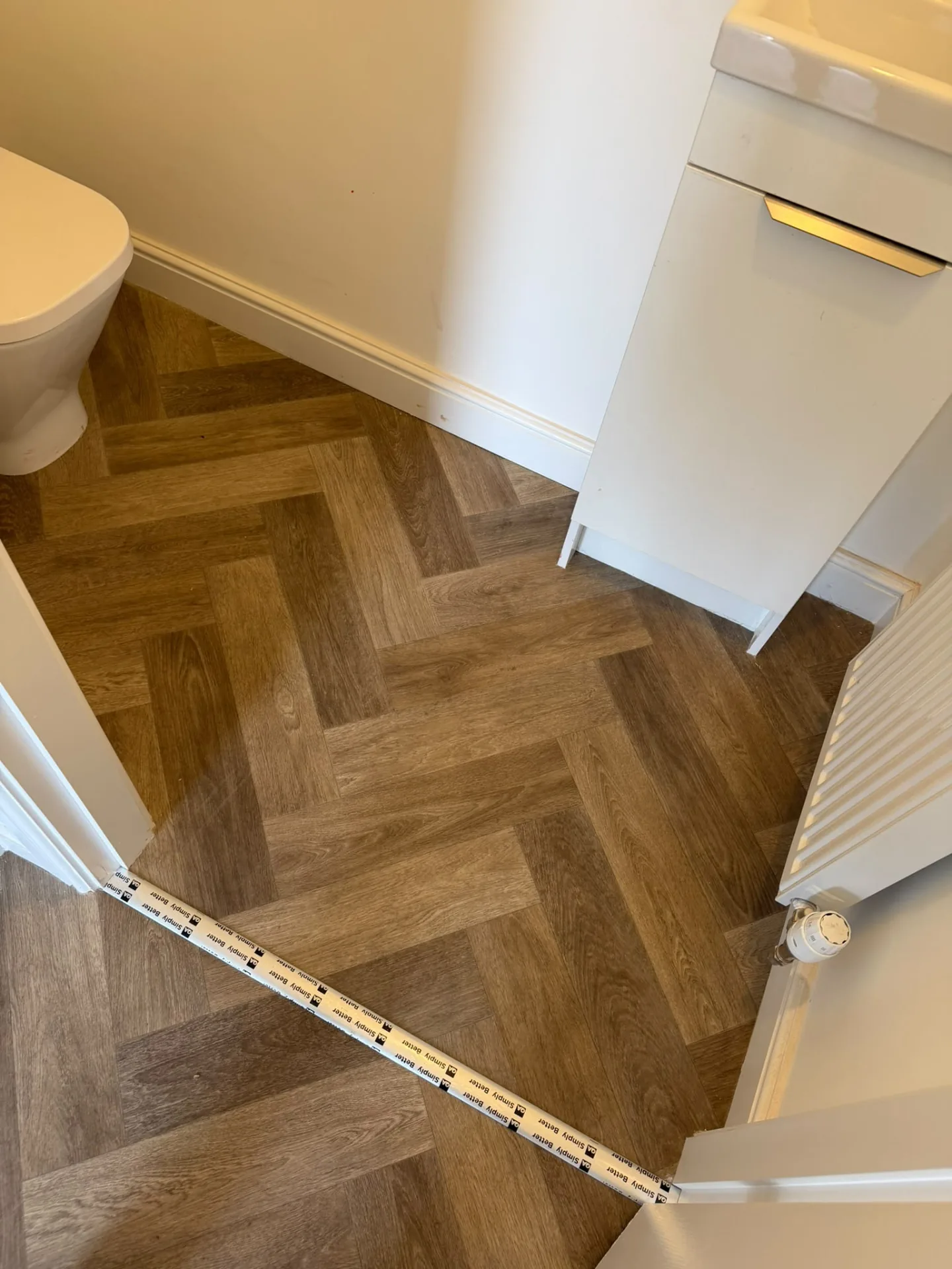 Herringbone vinyl flooring fitted in a downstairs cloakroom, Signature Carpets and Flooring, Greater Manchester