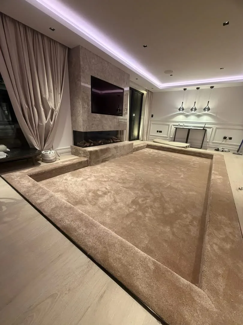Plush beige carpet fitted into a sunken lounge with carpeted steps and edges, Signature Carpets and Flooring, Greater Manchester