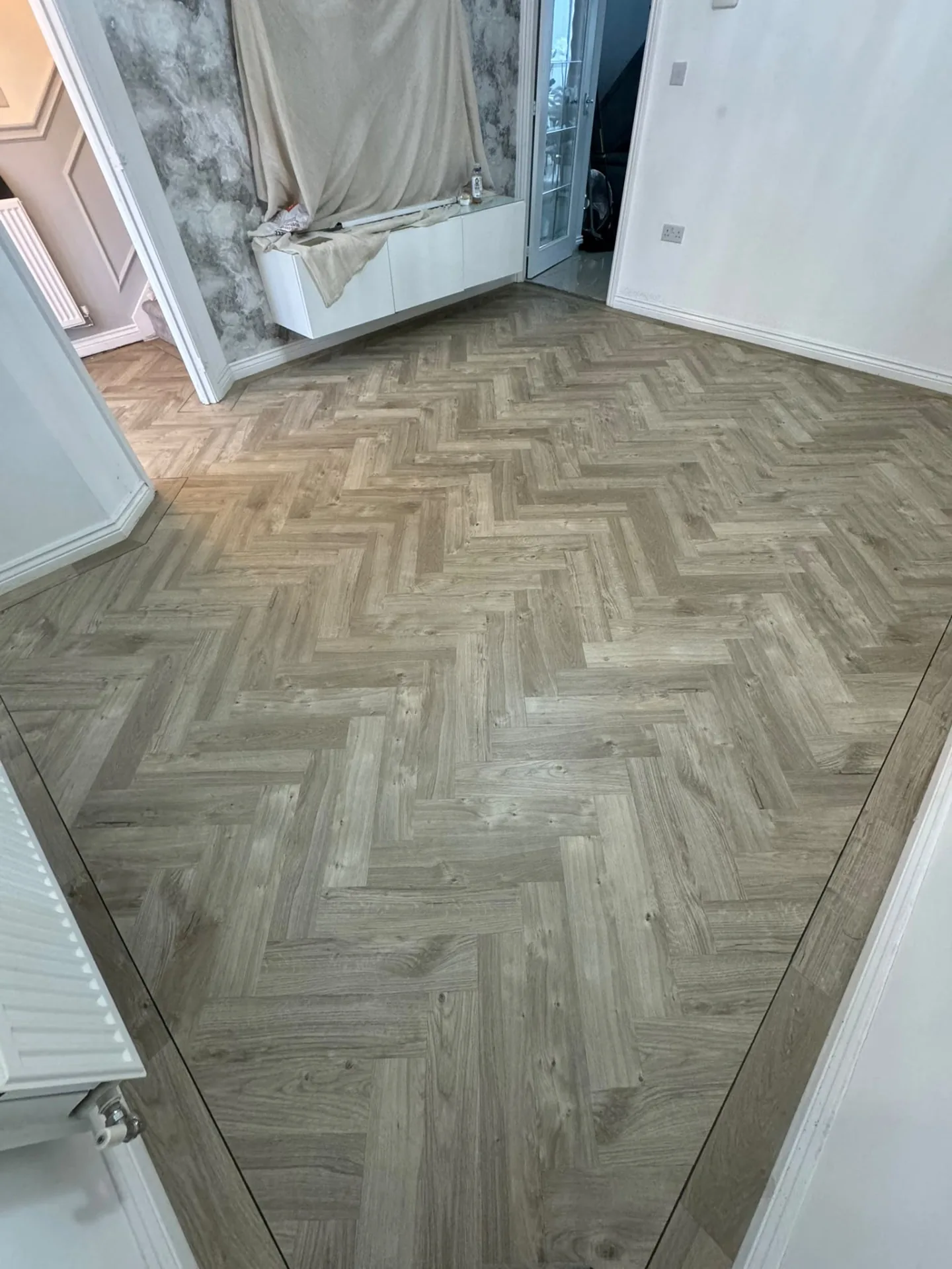Herringbone LVT flooring with a border fitted in a hallway, Signature Carpets and Flooring, Greater Manchester