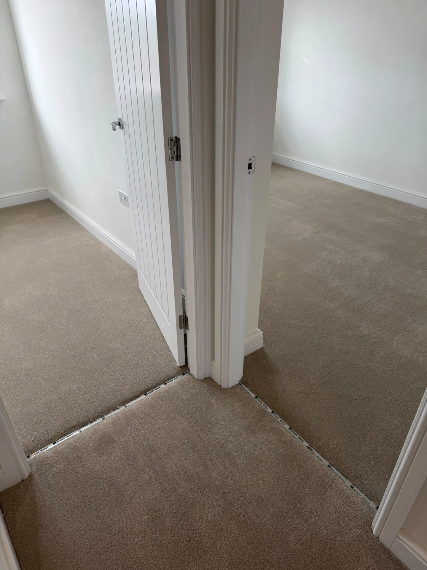 Carpeted landing joining bedrooms with neat threshold strips, Signature Carpets and Flooring, Greater Manchester