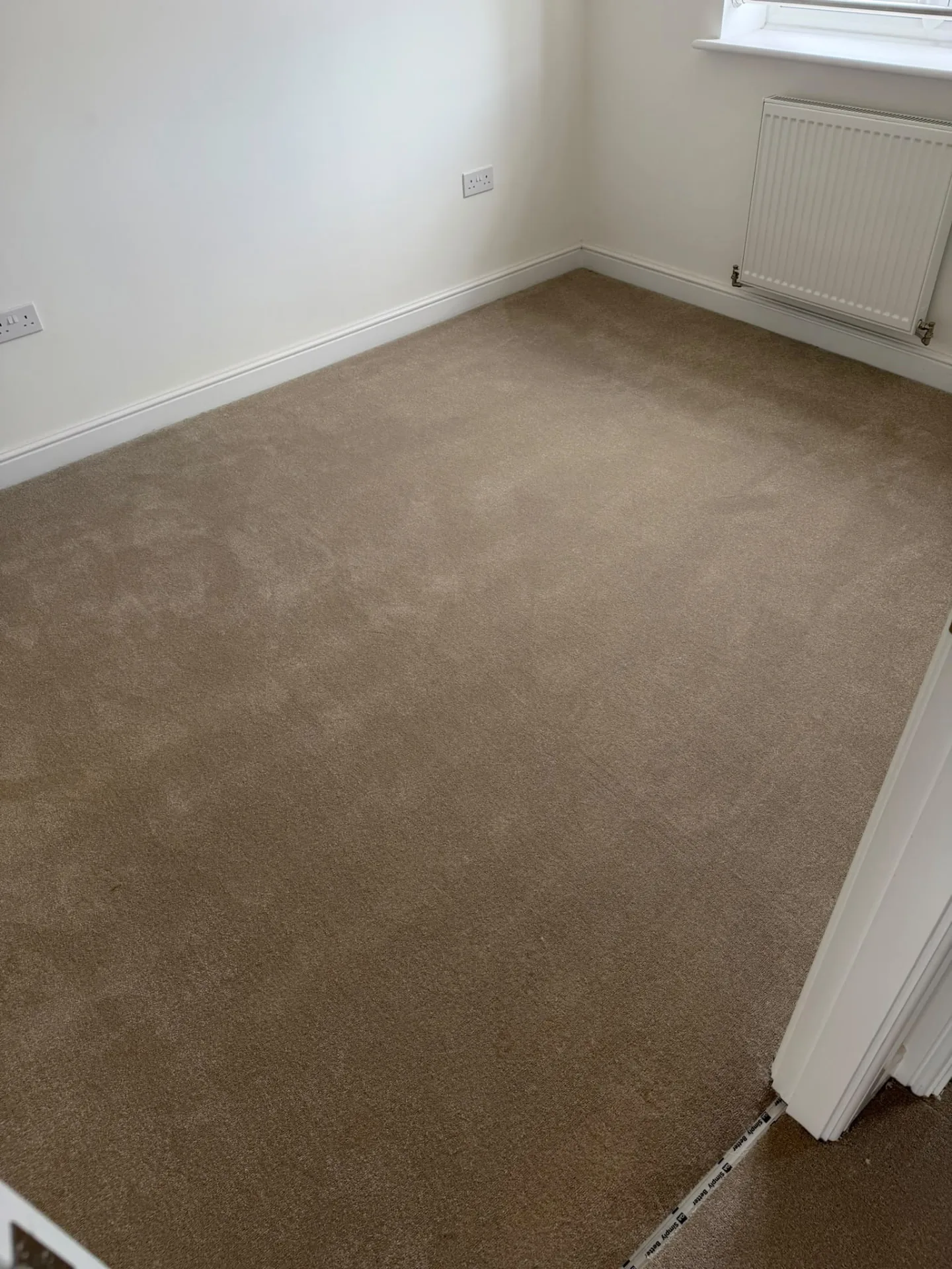 Beige bedroom carpet neatly fitted to the skirting, Signature Carpets and Flooring, Greater Manchester