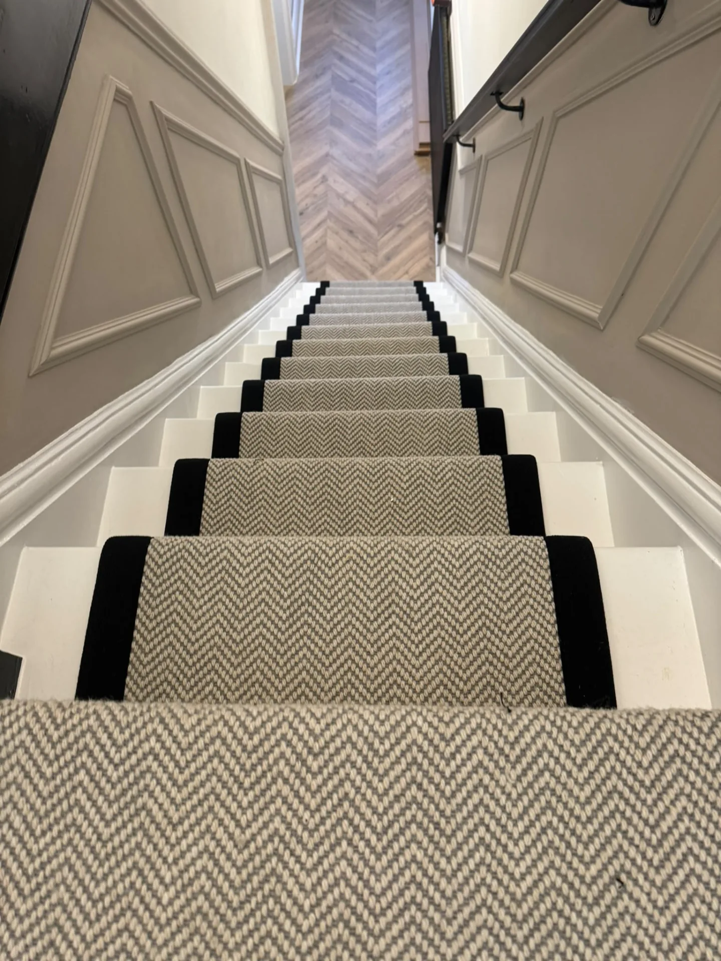 Patterned stair runner with dark borders fitted on a staircase, Signature Carpets and Flooring, Greater Manchester