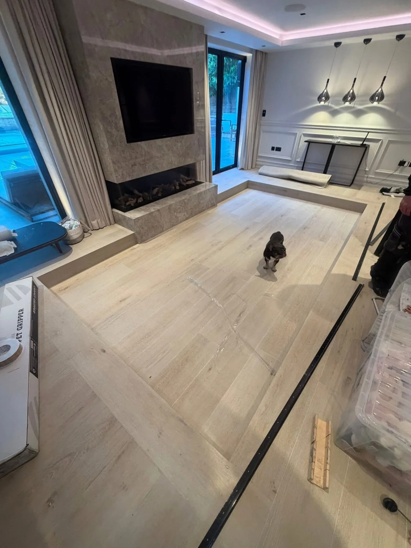 Sunken lounge before carpet fitting, with carpet gripper being laid around the edges, Signature Carpets and Flooring, Greater Manchester